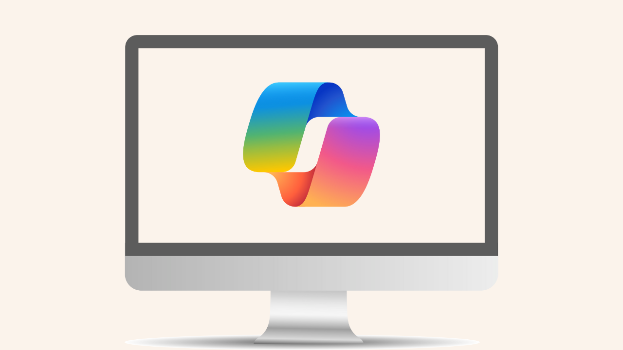 Monitor de computador exibindo o logotipo colorido e abstrato do Copilot. O logotipo consiste em duas formas interligadas com um esquema de cores gradiente, que transita entre azul, verde, amarelo, laranja e rosa. O monitor apresenta um design moderno e elegante, com uma moldura cinza e um suporte prateado. Imagem: reprodução.