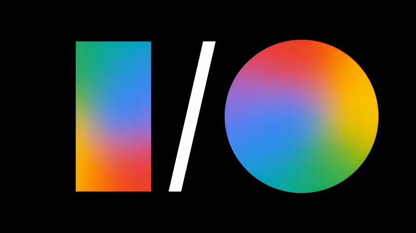 Logotipo do Google I/O exibido sobre fundo preto, com formas geométricas coloridas em degradê representando o evento anual da Google voltado para desenvolvedores e anúncios de novas tecnologias e recursos da empresa. Créditos: Google divulgação.